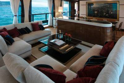 Luxurious yacht interiors offer a serene retreat with ocean views and elegant furnishings.