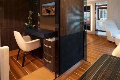Luxurious wood-paneled interiors offer a comfortable workspace and a serene lounge area with a view.