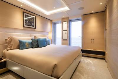 Luxurious yacht accommodations offer a serene retreat with ocean views and elegant decor.
