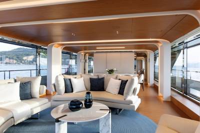 Luxurious yacht interiors blend seamlessly with breathtaking ocean views through expansive windows.