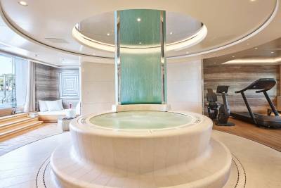 Indulge in ultimate relaxation with this luxurious spa featuring a cascading waterfall, jacuzzi, and state-of-the-art gym.