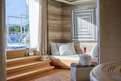 Relax in this serene yacht lounge with a refreshing drink and stunning ocean views.