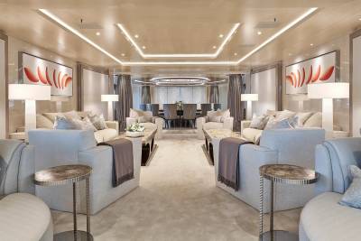Luxurious yacht interiors feature plush seating, contemporary art, and elegant lighting for ultimate relaxation.