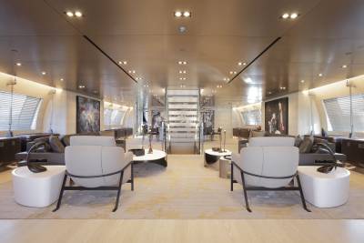 Luxurious yacht interiors feature sleek modern furniture and captivating artwork, creating an elegant ambiance.
