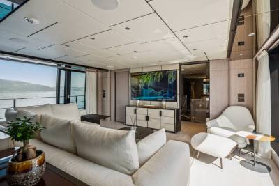 Relax in luxurious comfort aboard this yacht, featuring a spacious living area with stunning ocean views.