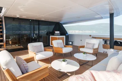 Relax in style on this luxurious yacht deck, complete with comfortable seating and stunning ocean views.