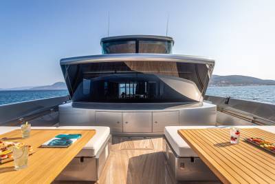 Enjoy refreshing drinks and light snacks on the deck of this luxurious yacht while cruising the azure waters.
