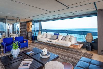 Luxurious yacht interiors offer breathtaking ocean views from a spacious, modern lounge.