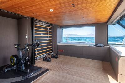 This yacht's gym offers a scenic workout with stunning ocean views and modern equipment.