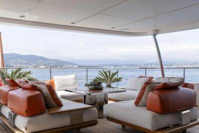 Relax on the luxurious deck of a yacht, enjoying the stunning coastal views and gentle sea breeze.