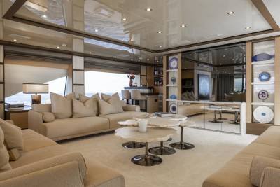 Luxurious yacht interiors feature plush seating and elegant decor, creating a serene oasis at sea.