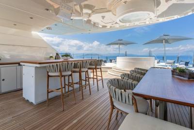 Enjoy alfresco dining and lounging with stunning ocean views from this luxurious yacht deck.