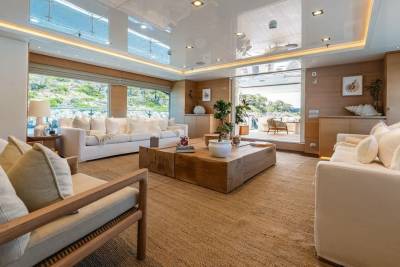 Luxurious yacht interiors blend natural textures with expansive views for ultimate relaxation.