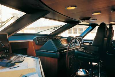 The luxurious yacht bridge offers a commanding view with advanced navigation systems and comfortable seating for the captain.