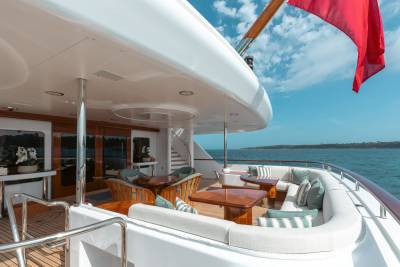 Luxurious yacht deck seating offers a serene spot to enjoy the ocean breeze and stunning coastal views.