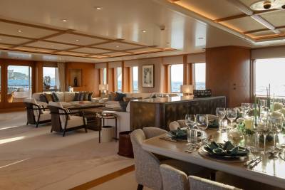 Elegant yacht interiors offer a luxurious setting for dining and relaxation with stunning ocean views.