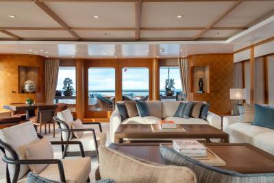 Luxurious yacht interiors offer a serene retreat with ocean views and elegant furnishings.