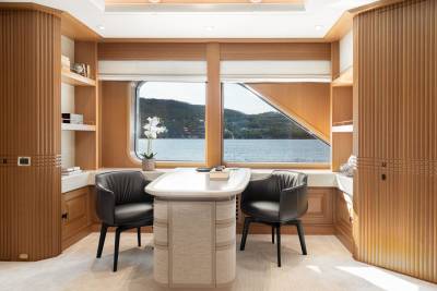 A modern office space with a stunning ocean view offers a serene environment for work and relaxation.