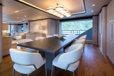 Dine in sophisticated style aboard this luxurious yacht, surrounded by elegant furnishings and breathtaking ocean views.