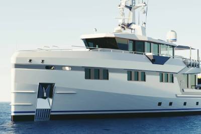 A sleek, modern yacht glides across calm blue waters under a clear sky.