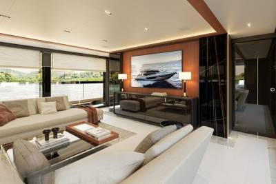 This luxurious yacht salon offers stunning ocean views and a sleek entertainment center.