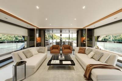 Luxurious yacht interiors offer a serene retreat with panoramic views of lush green landscapes and tranquil waters.