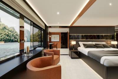 Luxurious bedroom with stunning waterfront views and modern amenities offers a serene escape.