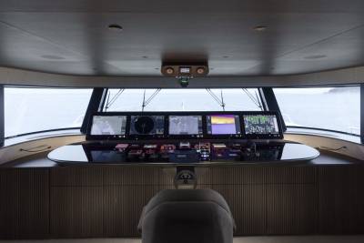 The modern yacht bridge offers panoramic views and an array of advanced navigation displays.