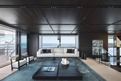 Luxurious yacht interiors offer breathtaking ocean views through expansive windows.