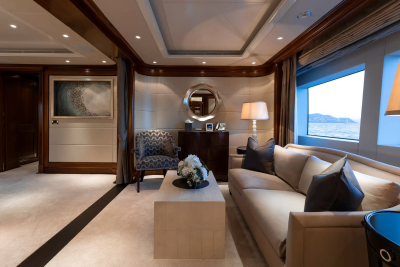 A luxurious yacht salon offers a serene retreat with plush seating and ocean views.