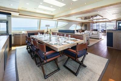 Dine in elegant style aboard this luxurious yacht, with a beautifully set table overlooking the sparkling ocean.