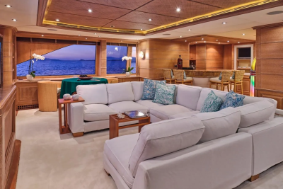 Luxurious yacht interiors offer a comfortable lounge with ocean views and a well-stocked bar.