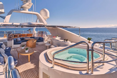 Relax in the onboard jacuzzi with stunning ocean views from this luxurious yacht deck.