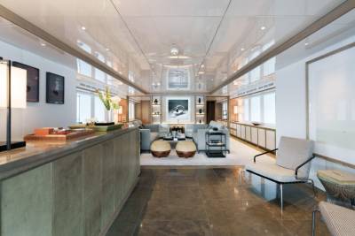 Luxurious yacht interiors feature a sleek, modern design with comfortable seating and elegant decor.