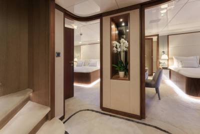 Luxurious staterooms on a yacht offer plush bedding and elegant decor for ultimate comfort.