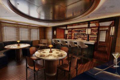 In the foreground, round tables with chairs are set for dining, while the background features a well-stocked bar with stools and ambient lighting.