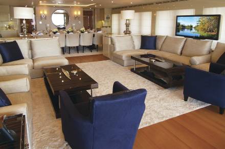 Luxurious yacht interiors offer elegant seating areas and a formal dining room for sophisticated entertaining.