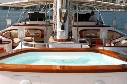 Relax in the onboard jacuzzi, surrounded by luxurious seating and the beautiful open sea.