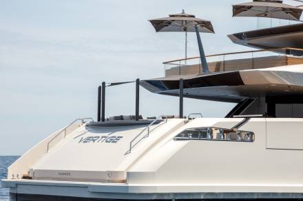 The luxurious yacht "Vertige" cruises through the Mediterranean Sea under a clear blue sky.