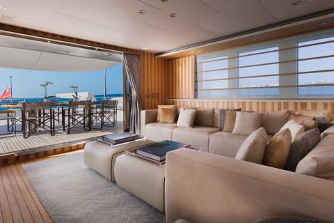 Luxurious yacht interiors seamlessly blend with outdoor living spaces, offering breathtaking ocean views and elegant comfort.