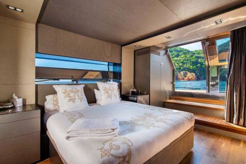 Wake up to breathtaking ocean views from this luxurious bedroom with direct access to the water.