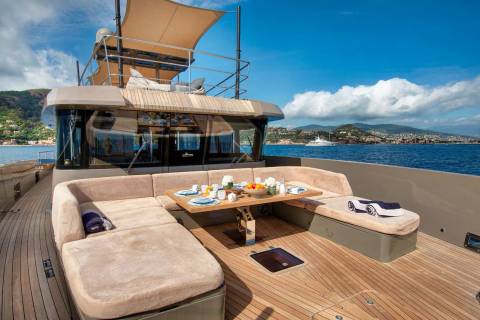 Enjoy a leisurely breakfast on the deck of this luxurious yacht, surrounded by the stunning Mediterranean coastline.