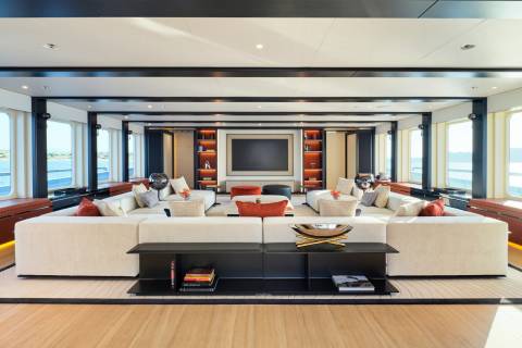 Luxurious yacht interiors offer plush seating and panoramic ocean views for ultimate relaxation.