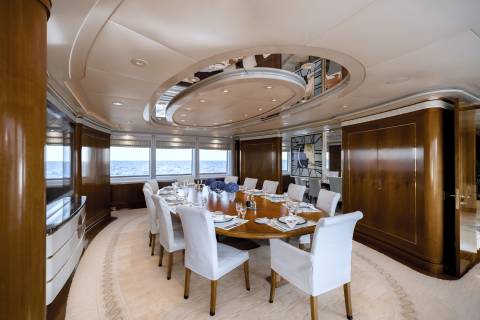 Dine in opulent style aboard this yacht's elegant dining room with panoramic ocean views.