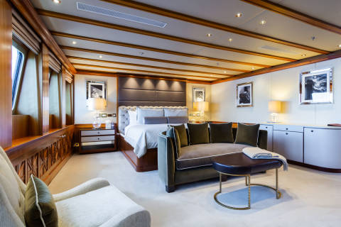 Luxurious yacht interiors feature plush seating, elegant lighting, and framed artwork for a sophisticated retreat at sea.
