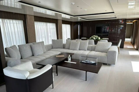 Luxurious yacht interiors feature plush seating, sleek coffee tables, and elegant decor for ultimate relaxation.