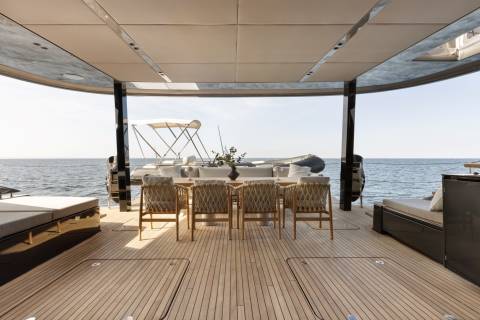 Relax on the spacious deck of this luxury yacht, surrounded by the calm blue sea.