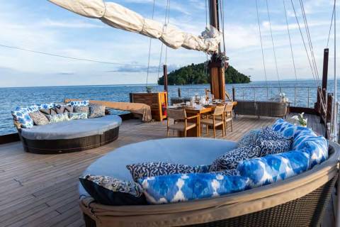 Relax on the deck of this luxurious yacht, surrounded by the tranquil ocean and lush tropical islands.