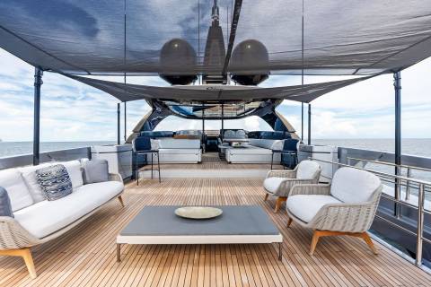 Relax on the spacious deck of this luxurious yacht, enjoying the ocean breeze and stunning sky views.