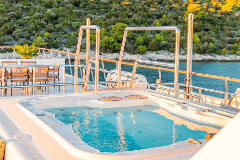Relax and unwind in the luxurious onboard jacuzzi with stunning views of the lush coastline.